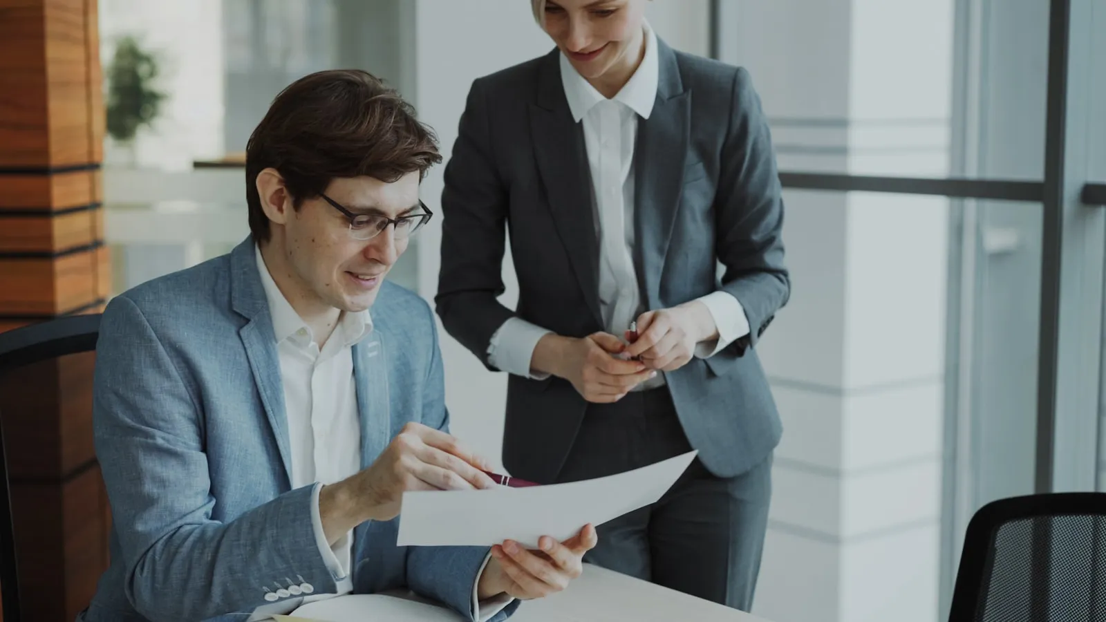 Two consultants reviewing documents together during a readiness assessment