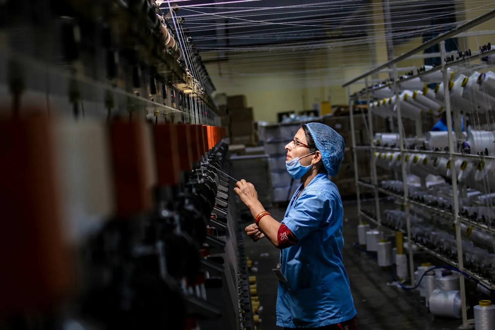Manufacturing worker performing quality control on a production line