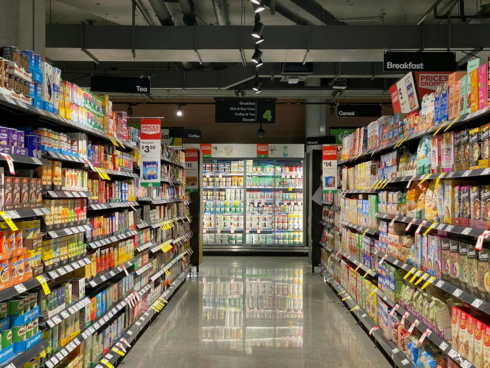 A stocked grocery retail aisle with shelved products